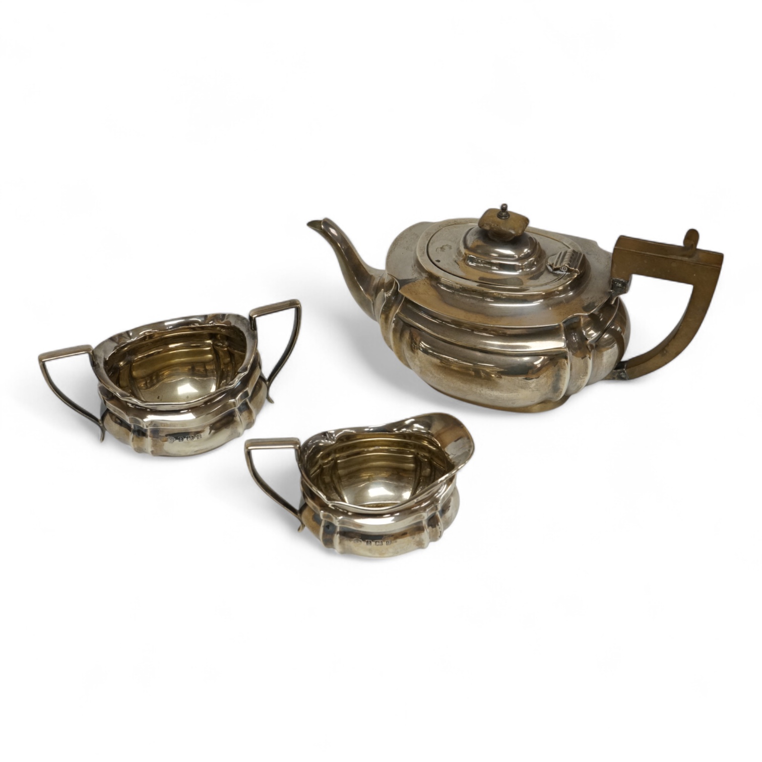 A George V silver oval three piece tea set, by Alexander Clark & Co Ltd, Birmingham, 1914 & 1916, gross weight 18.9oz.